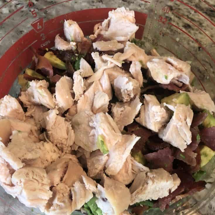 chicken, bacon, and avocado in a mixing bowl
