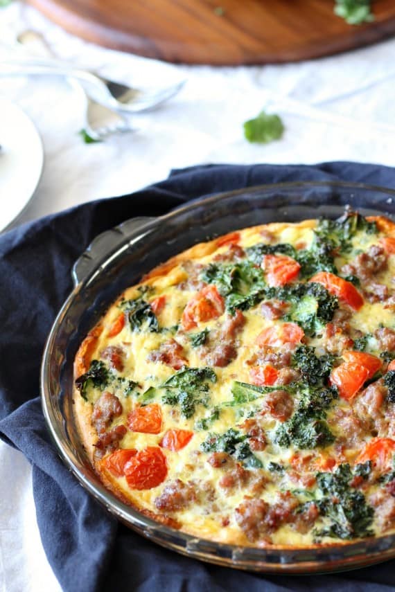 Butternut crusted quiche with sausage tomatoes and kale