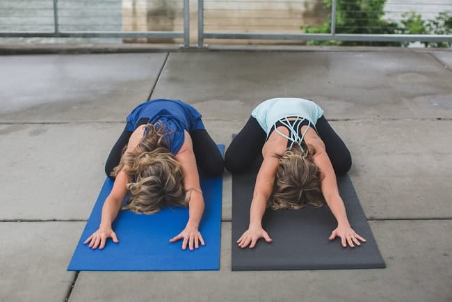 kim and kalee doing child's post next to each other