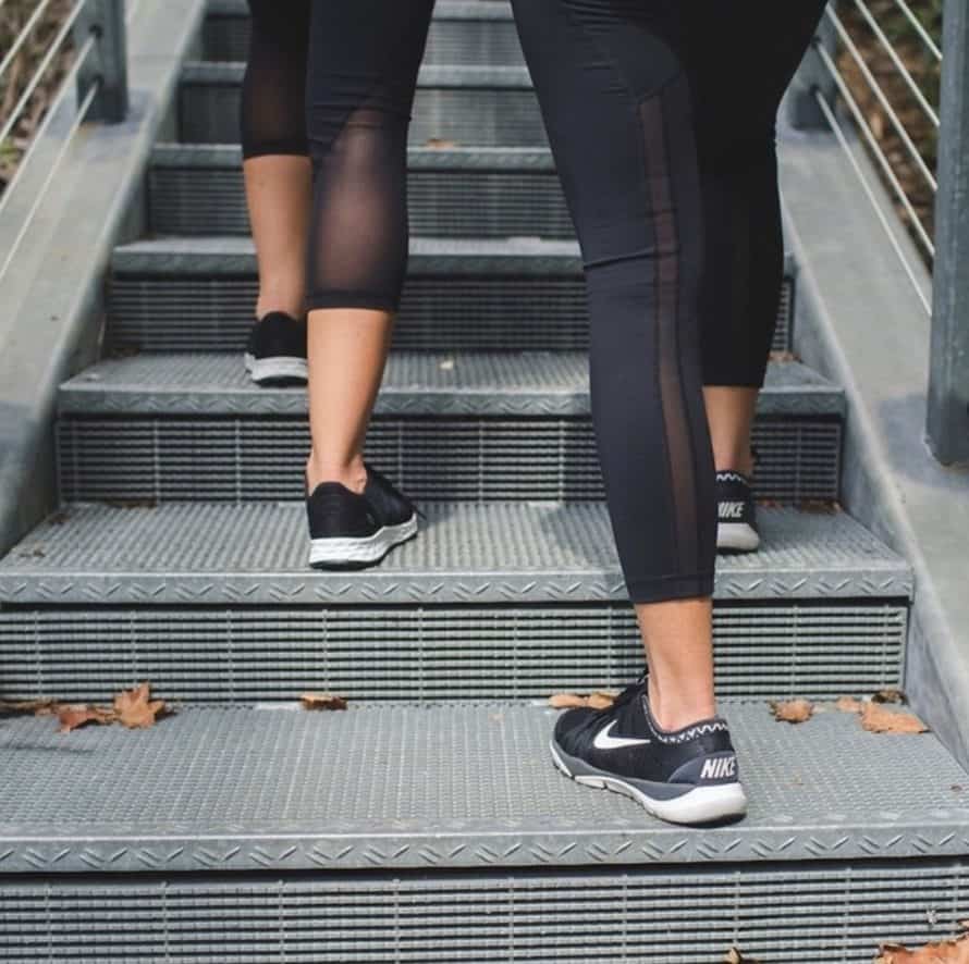 back of kim and kalee legs taking stairs