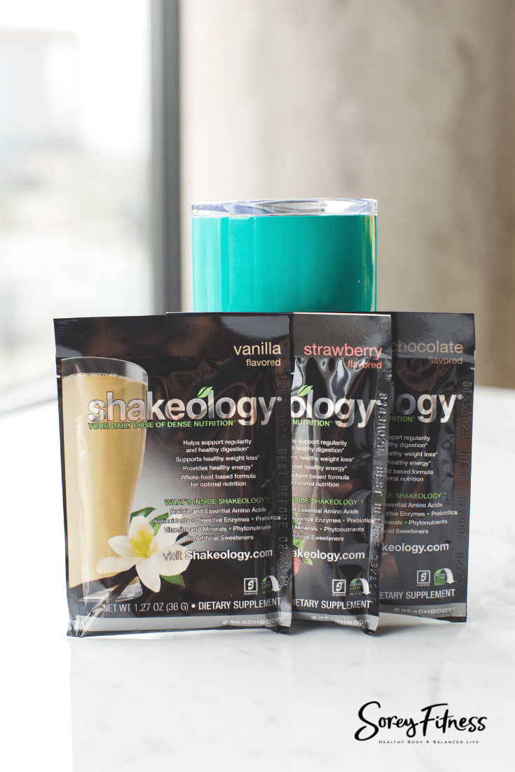 3 packs of shakeology and a cup