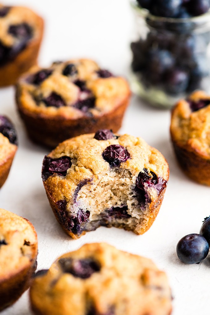 blueberry muffin with a bite taken from it