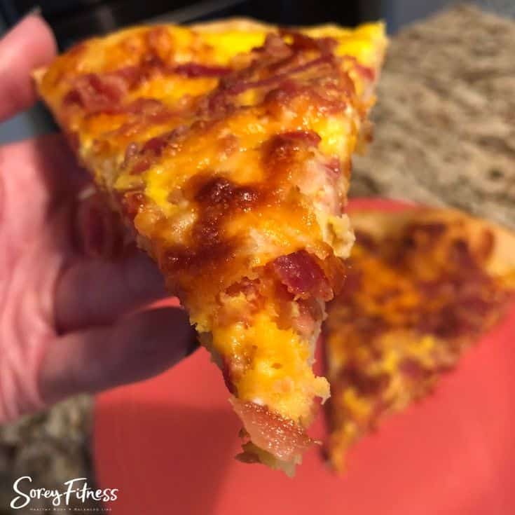 Slice of the bacon, egg and cheese pizza