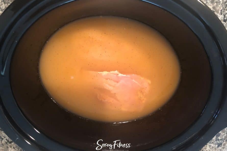 making slow cooker chicken for tacos