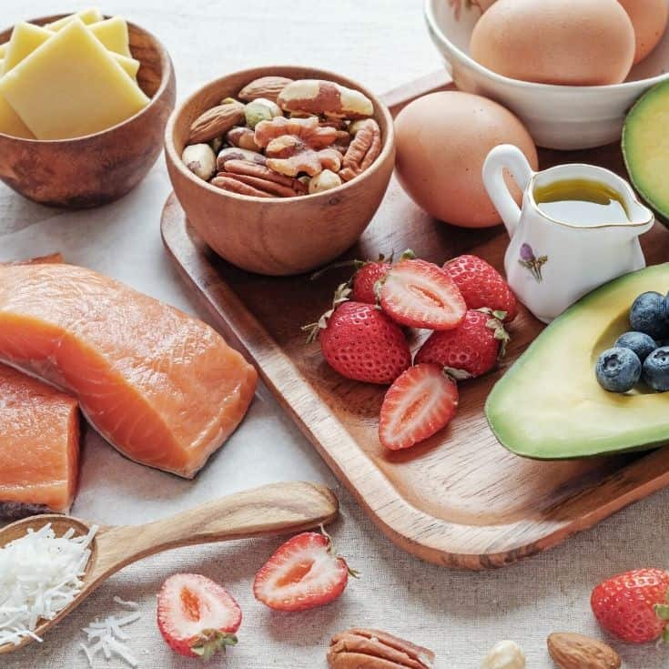Nuts, Salmon, Coconut Flakes, and berries are part of the keto diet plan.