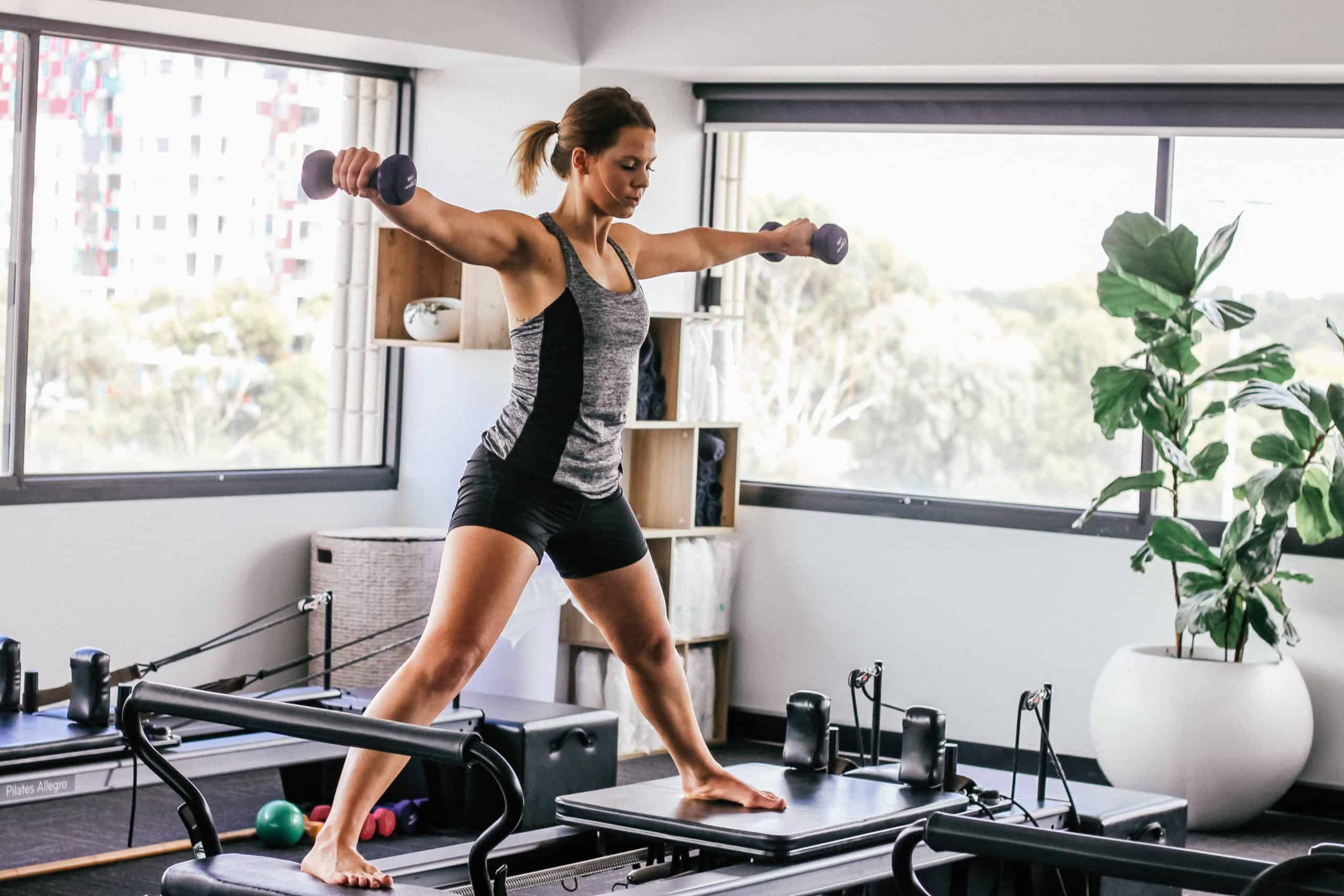woman on a pilates reformer