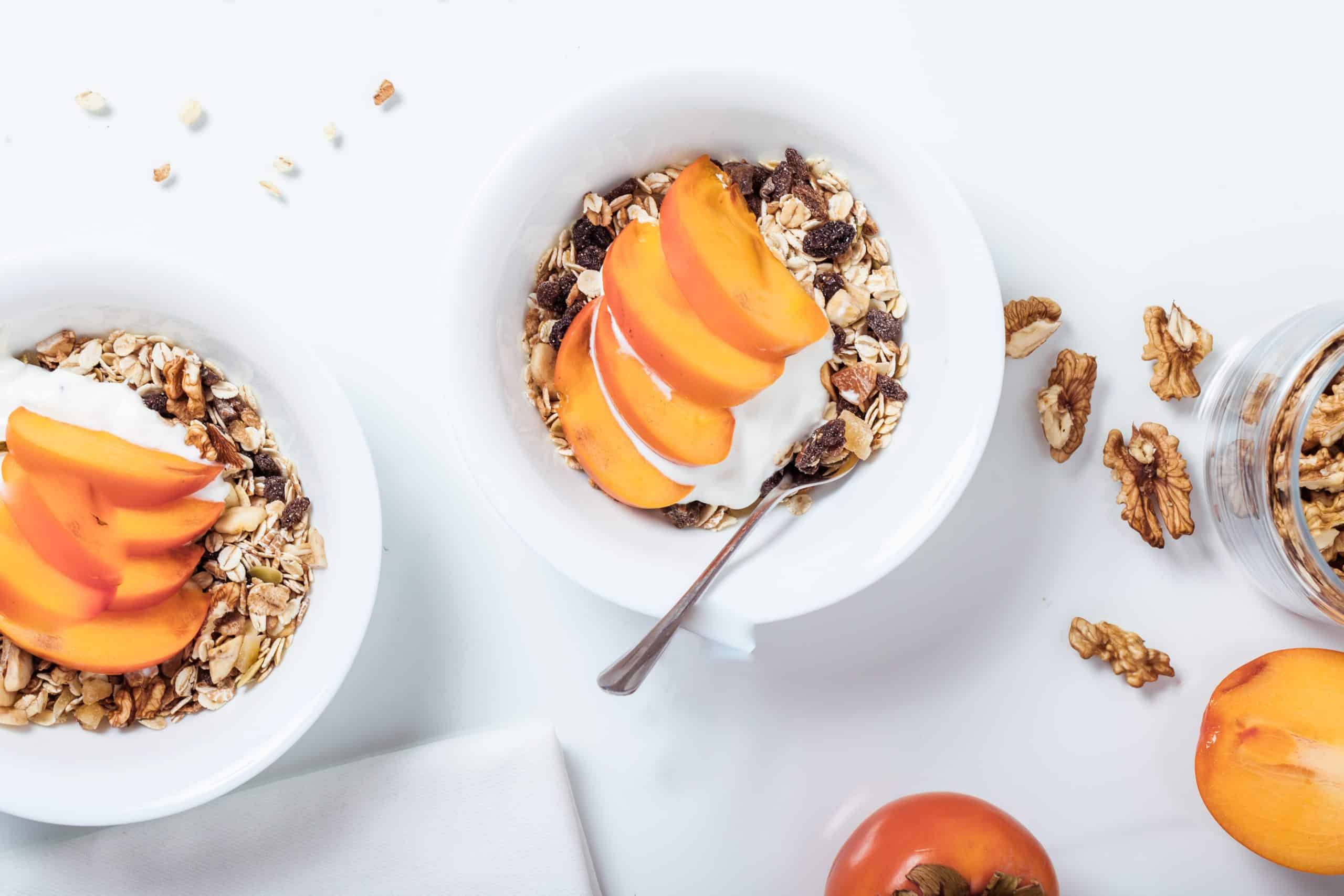 bowls of granola with peaches