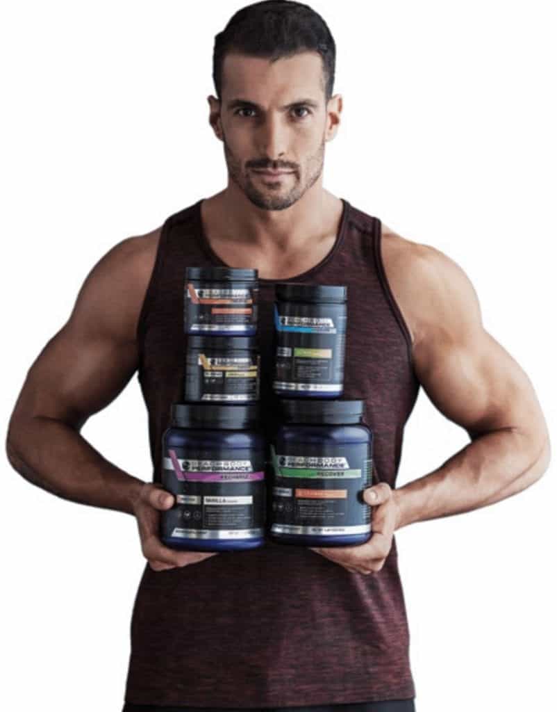 Joel holds 10 Rounds Beachbody Supplements