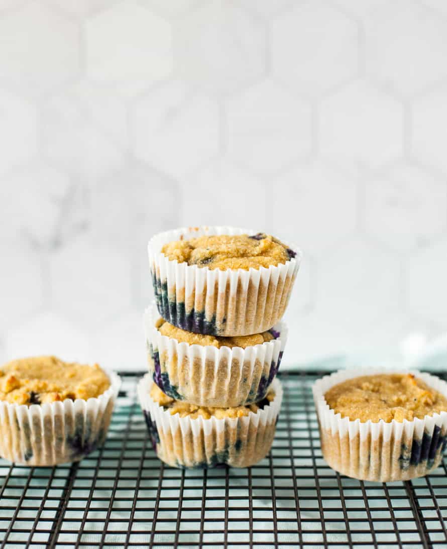 stack of grain free blueberry muffins on cooling rack