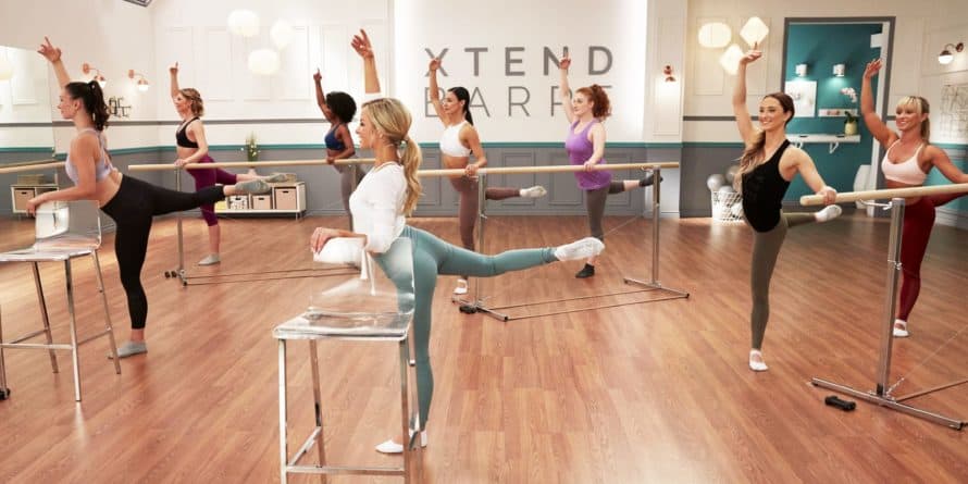 several women doing an attitude leg lift in xtend barre