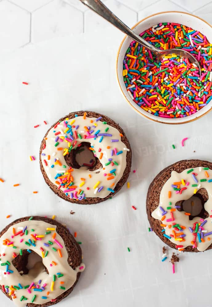 overhead photo of healthy protein donuts with rainbow sprinkles