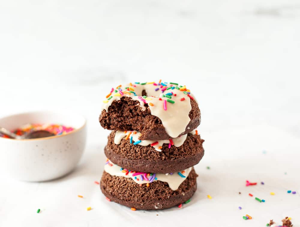 stack of chocolate donuts with sprinkles