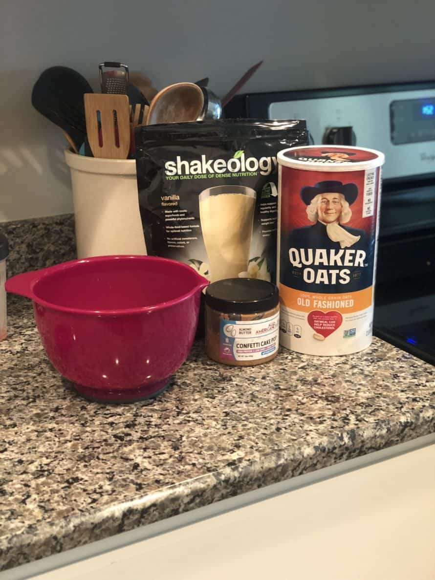shakeology, oatmeal, almond butter, and a mixing bowl