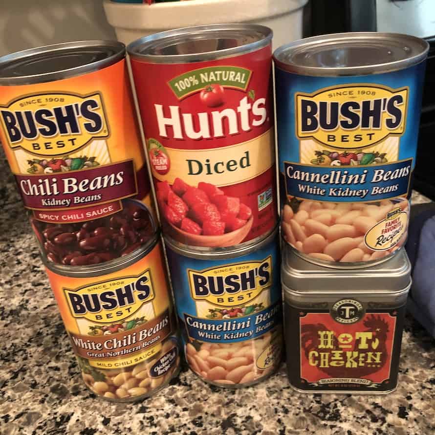 cans of beans, tomatoes, and nashville hot chicken seasoning 