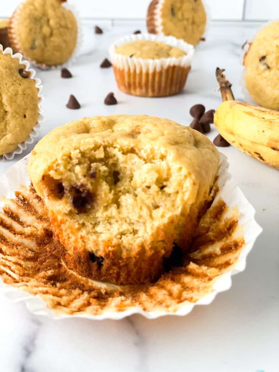 easy gluten free banana chocolate chip muffin with a bite out of it