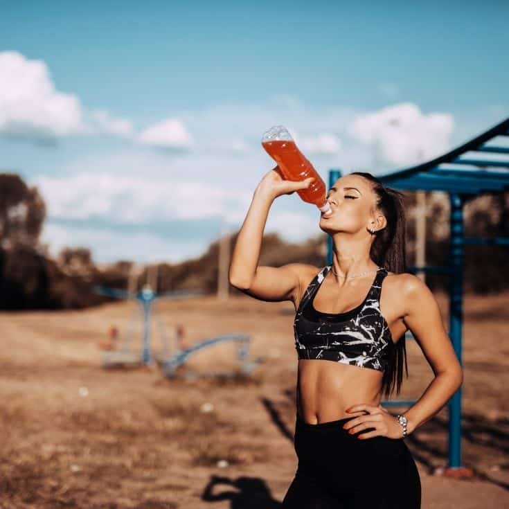 woman drinking a popular sports drink