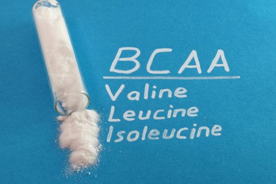 BCAA Valine Leucine Isoleucine written next to the powder form of BCAA