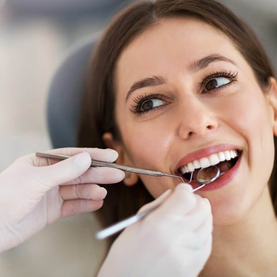 woman in having her teeth looked at by an oral surgeon