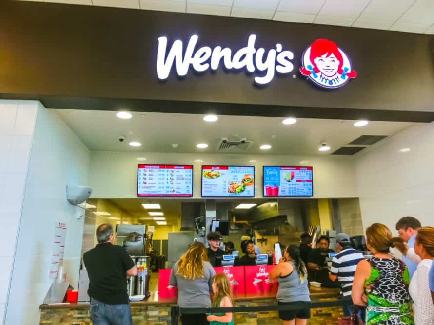 people ordering food inside a Wendy's in FL