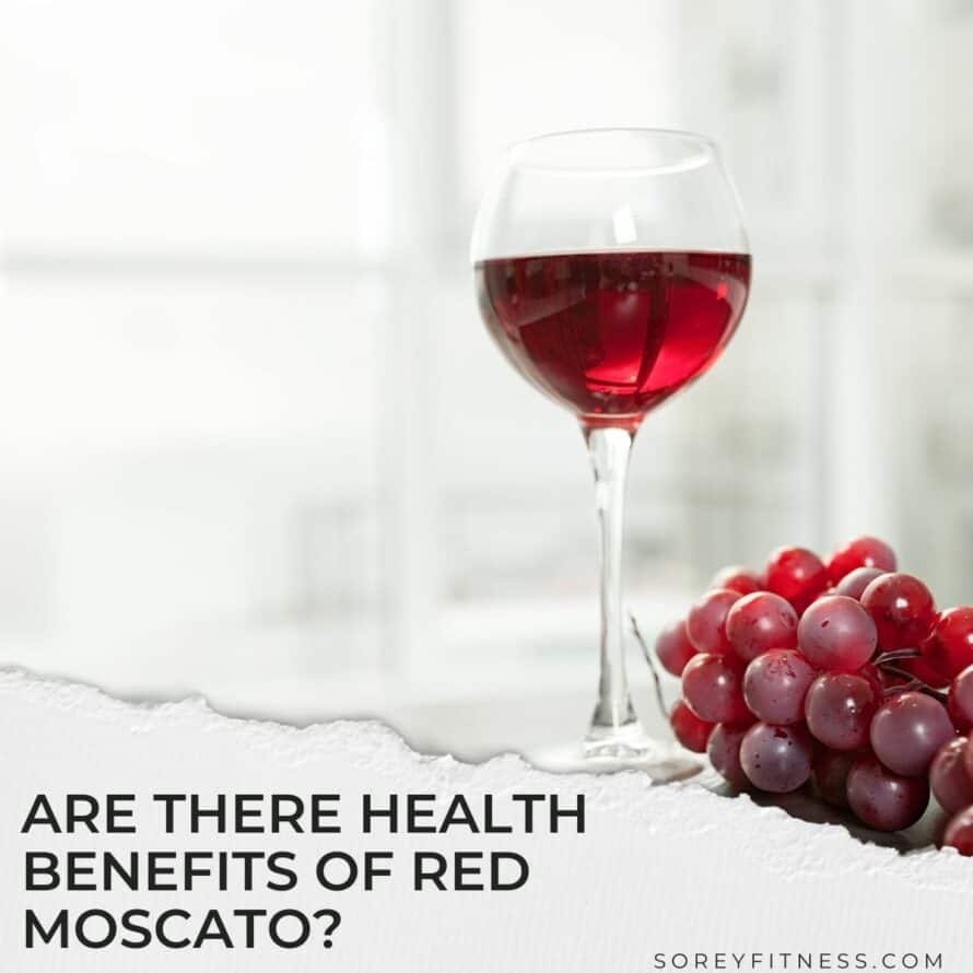 a glass of red wine with grapes below and the text overlay "are there health benefits of red moscato?"