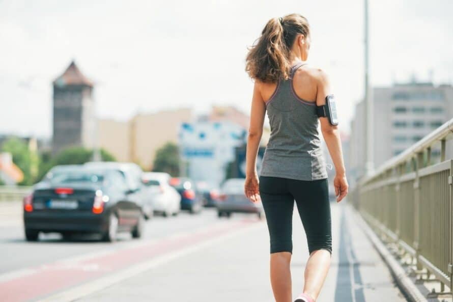 back of a woman walking in the city