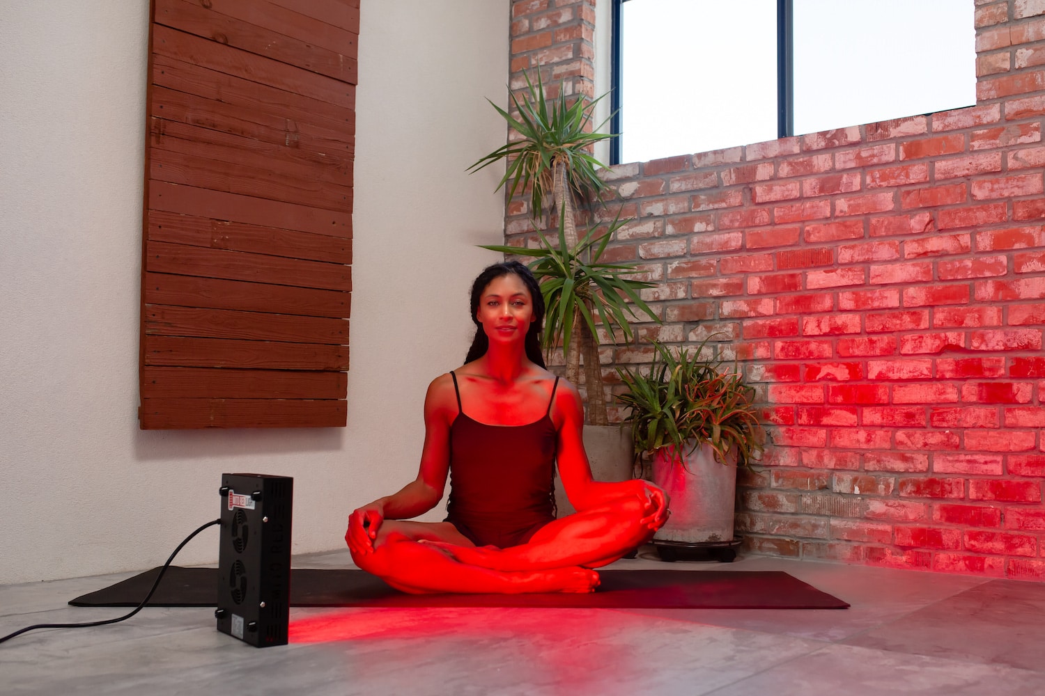 woman sitting by a mobile Mito light panel