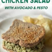 Text overlay at the top says 4 Ingredient Healthy Chicken Salad with Avocado and Pesto - Shows a chicken salad sandwich with Siete potato chips in the background