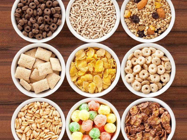 variety of breakfast cereals in different bowls