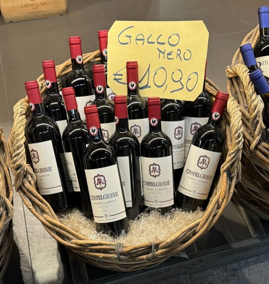 several bottles of chianti classico in a basket for sale