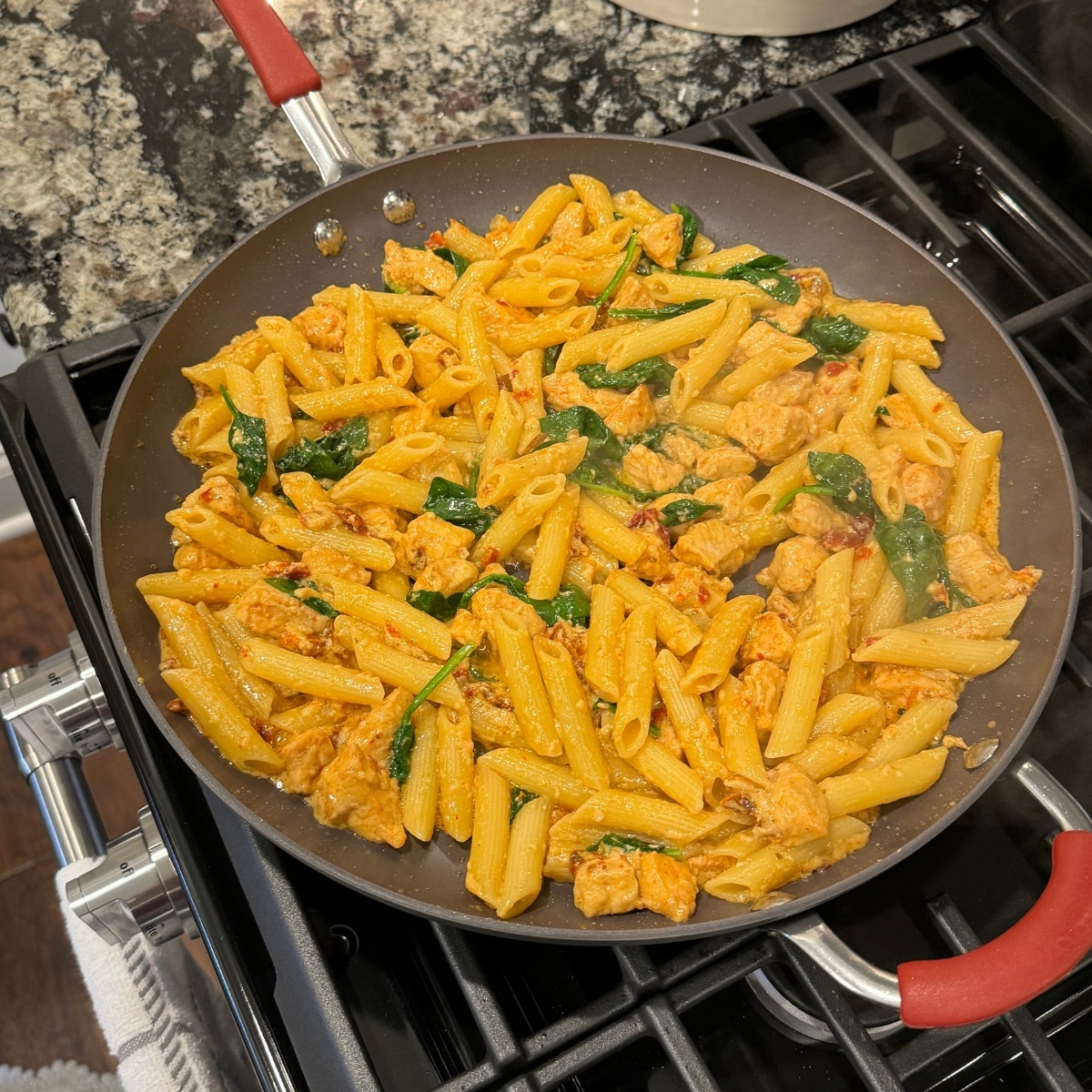making creamy chicken tuscan pasta in one skillet