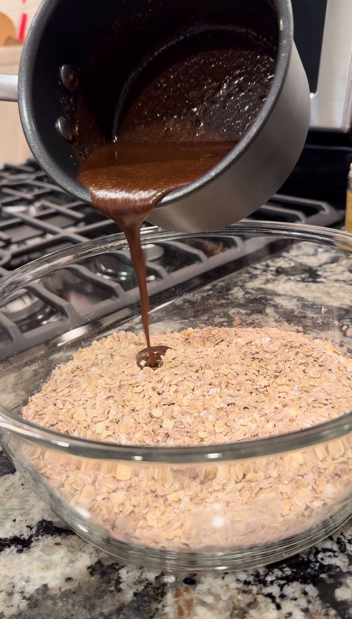 pouring chocolate mixture into oatmeal