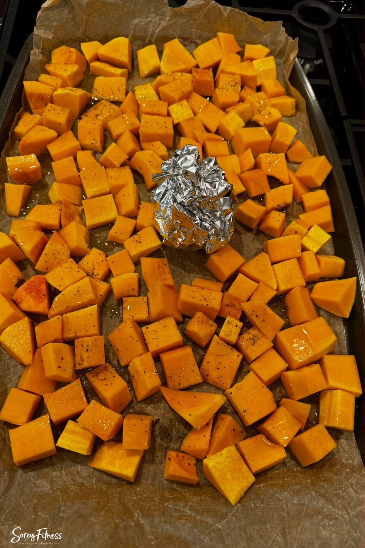 Roasting Butternut Squash and Garlic on  a pan