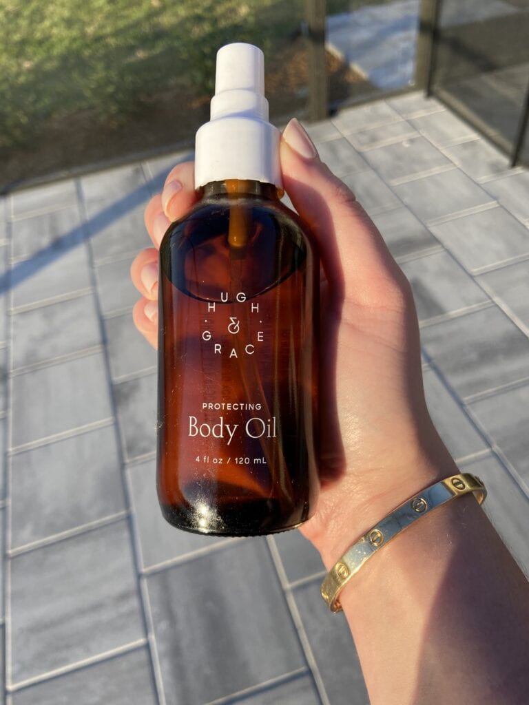 holding hugh and grace body oil