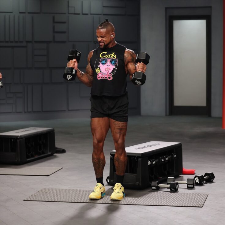 shaun t doing bicep curls in dig in
