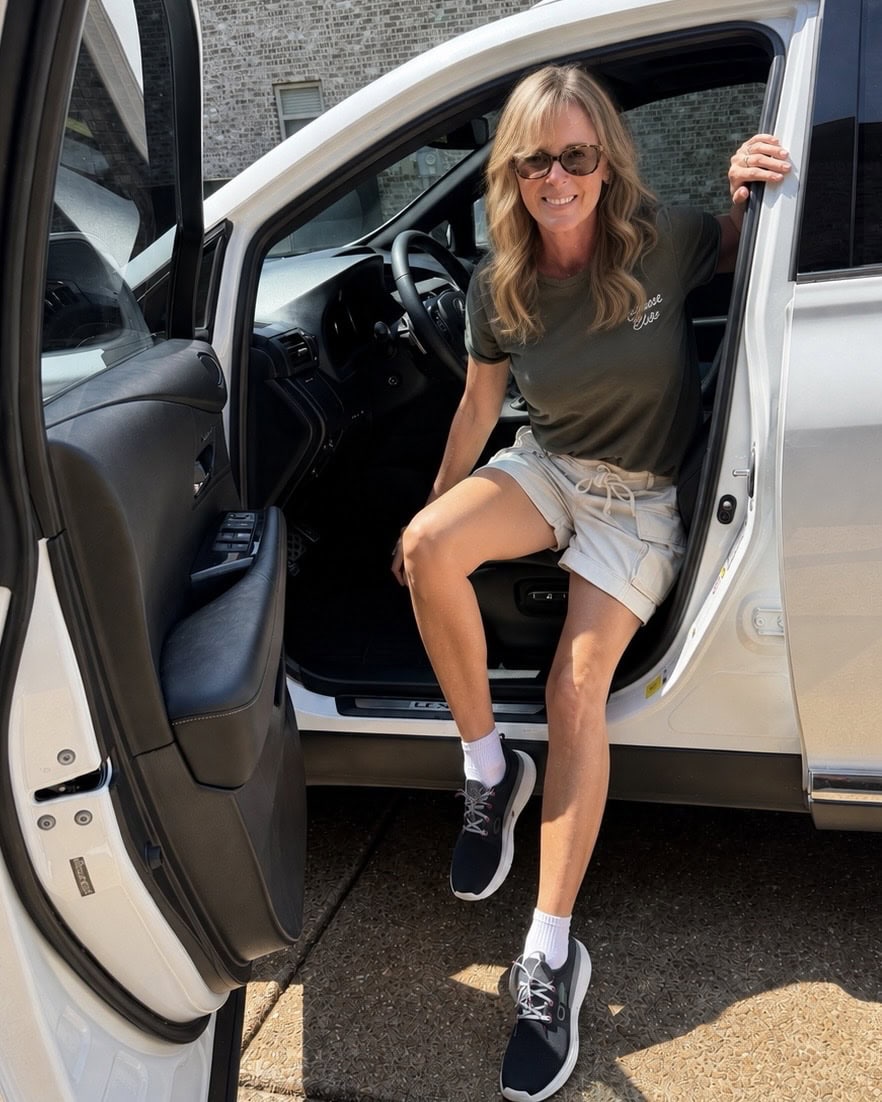 Kim traveling in her OOFOS